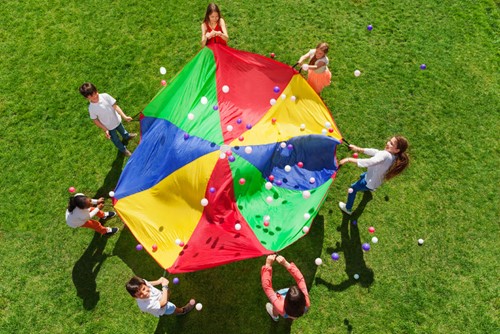 Children playing with parachute
